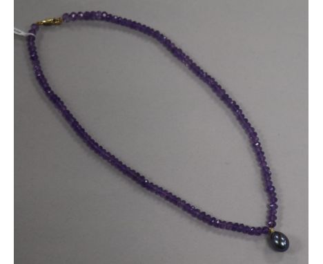 A single strand facetted amethyst bead necklace with Tahitian cultured pearl drop and 9ct gold clasp, approx. 38cm.