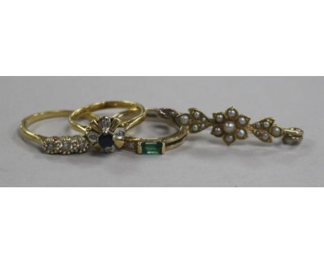Three 18ct gold and gem set rings and a yellow metal and seed pearl bar brooch.