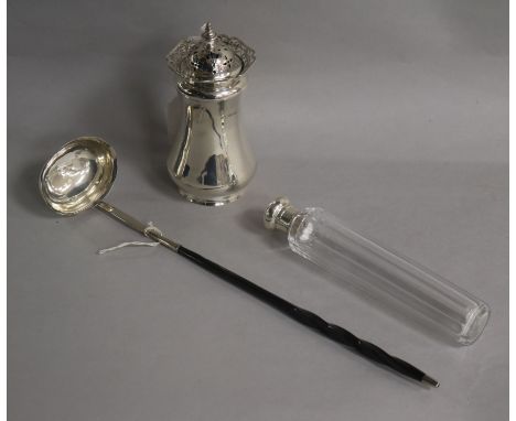 A George III silver toddy ladle, a silver sugar caster and a silver topped toilet bottle.