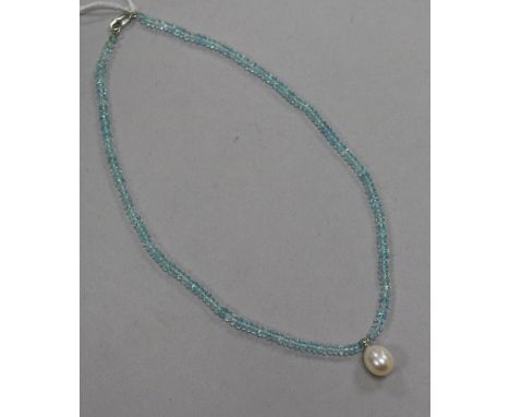 A single strand facetted aquamarine bead necklace, with freshwater pearl drop and 14ct white gold clasp, 35cm.