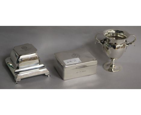 A 1930's silver inkstand, a silver trophy cup and a silver cigarette box.