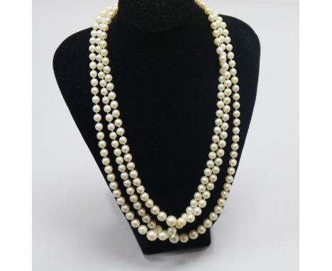 A triple strand graduated cultured pearl necklace, with 9ct gold circular clasp, 46cm.