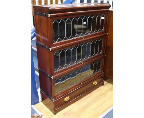 A Globe Wernike 3 section mahogany leaded bookcase W.86cm.