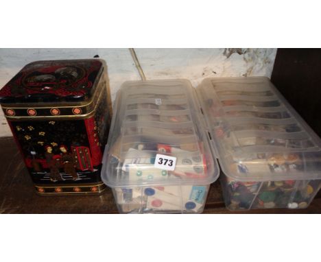Three containers full of vintage buttons