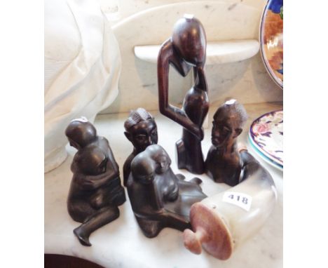 Carved wooden African figures, horn powder flask and two figures by D. Smith