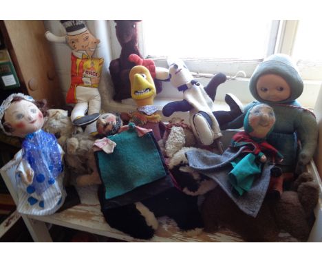 Large collection of vintage soft toys including a Merrythought Parrot on a Perch, Mickey Mouse, a badger and seven glove pupp