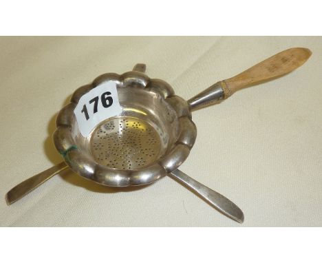 Continental silver tea strainer on tripod legs