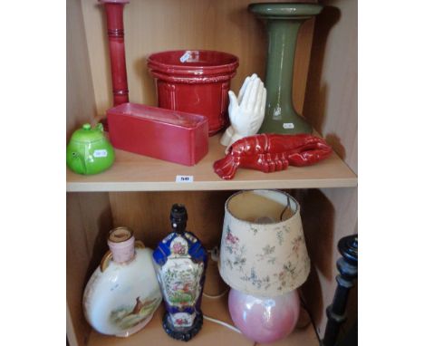 Two shelves of assorted items, inc. ham stand, Bretby pottery planter, tall pottery candlestick and three china table lamp ba