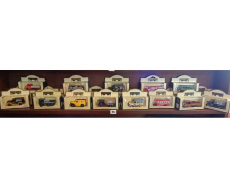 Shelf of assorted modern diecast vehicles