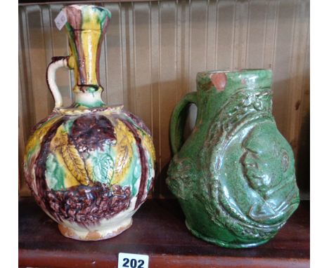Ottoman Chanakkale polychrome pottery ewer, 27cms and an unusual later green glazed similar with portrait mask of Ataturk 