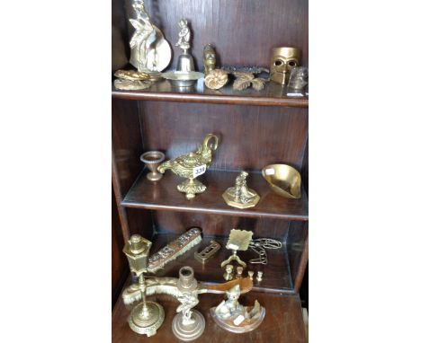 Ornate brass spirit lamp inkwell, an Indian brass hookah smoking figure, a large quantity of small brass ornaments and a copp