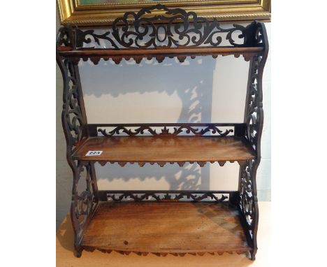 Victorian mahogany three tier wall shelf on fretwork supports and galleries