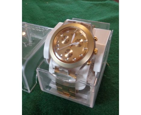 Gold coloured chunky men's Swatch watch in case