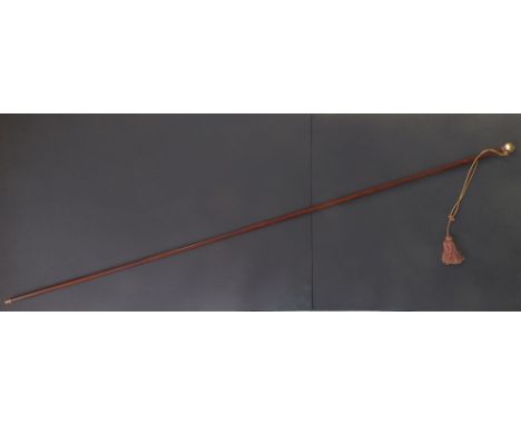 A late 19thC lady's rhino horn riding whip with engine turned yellow metal pommel, 27.5”