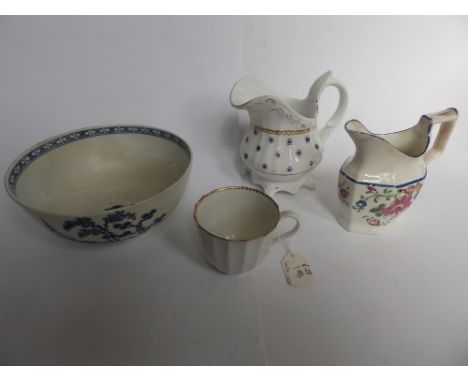 An early Worcester white glazed porcelain coffee cup, a Hamilton & Moore cream jug, one other and a restored Worcester bowl (