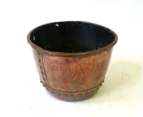 A copper planter/log bucket late 19th CenturyCircular 51cm diameter planter with construction studs, height 37cm