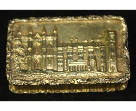 A Victorian silver gilt castle top vinaigretteOf rectangular form, with applied scroll rims and engine turned decoration, the