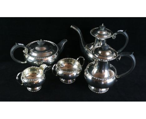 A silver five piece tea and coffee serviceOf circular baluster form, with applied cotton and reel borders, with ebonised hand