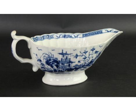 An 18th Century Worcester blue and white sauce boatDecorated in the 'Mission Church' pattern, crescent mark to base, height 1