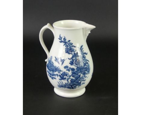 An 18th Century Worcester blue and white milk jugOf baluster form, decorated in the 'Fence' pattern, with a mask spout, heigh