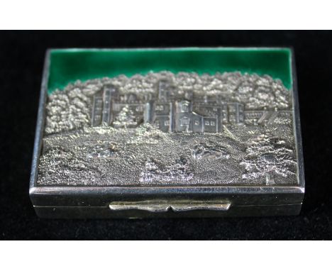 A silver and enamel snuff boxOf rectangular form, the lid depicting a stately home amongst the grounds, possibly Haddon Hall,