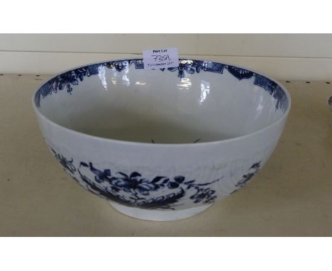 An 18th Century Worcester blue and white bowlRelief moulded with scrolls and painted in underglazed blue with floral sprays, 