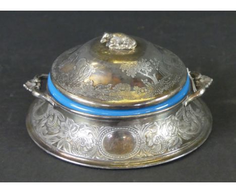 A late 19th century silver-plated twin handled butter dishOf circular form, the domed lid with a cow finial, to a replacement