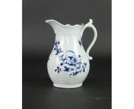 An 18th Century Worcester blue and white cream jugHaving feather moulded decoration with an under glazed blue floral motif, h