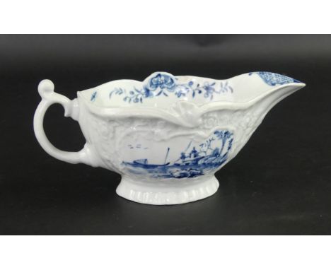 An 18th Century Worcester blue and white sauce boatRelief moulded with floral sprigging and decorated in the 'Moored Boat' pa
