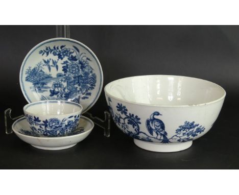 Four pieces of 18th Century Worcester blue and white To include slop bowl decorated in the 'Birds in Branches' pattern, cresc