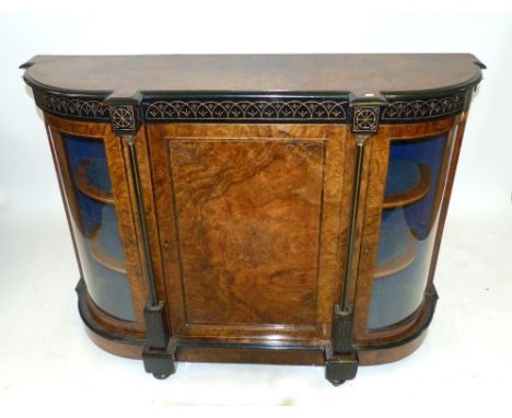 A 19th Century walnut and ebonised credenza The central door opens to reveal velvet lined shelf, the front with ebonised band