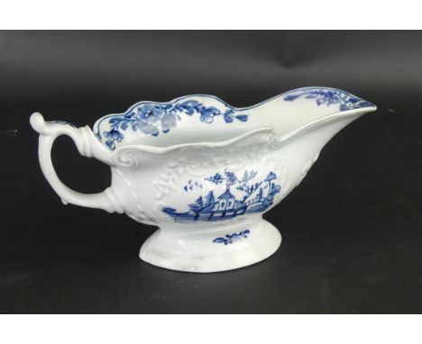 An 18th Century Worcester blue and white sauce boatWith relief moulding of scrolls and foliate, painted in underglazed blue w
