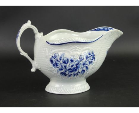 An 18th Century Worcester blue and white sauce boat Decorated with basket moulding and painted with blue flowers, height 10cm