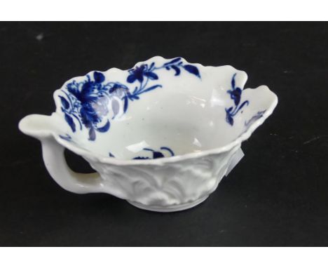 An 18th Century Worcester blue and white butter boat Relief geranium moulded, decorated in the 'Mansfield' pattern, height 3.