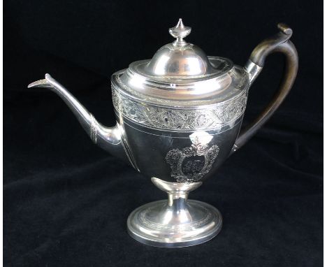 A George III silver teapotOf navette form, profusely engraved with scroll and foliate decoration, the domed lid with an urn s