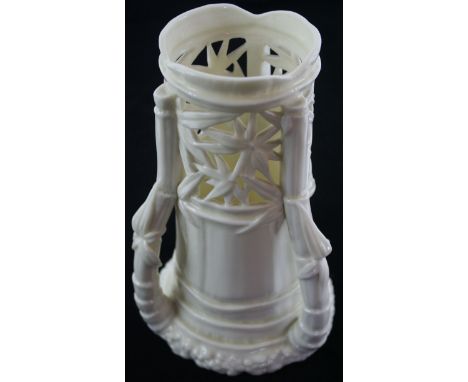 A 19th Century three handled Worcester blanc de chine vaseHaving pierced floral decoration to top rim, green factory marks to