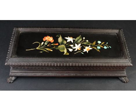 A Victorian Ashford marble and ebonised wooden boxOf rectangular form, raised on carved lions paw feet, height 8cm, length 34