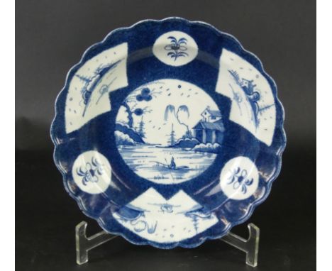 An 18th Century Worcester blue and white plateDecorated in the 'Fence Panelled Landscape' pattern, blue painted marks to base