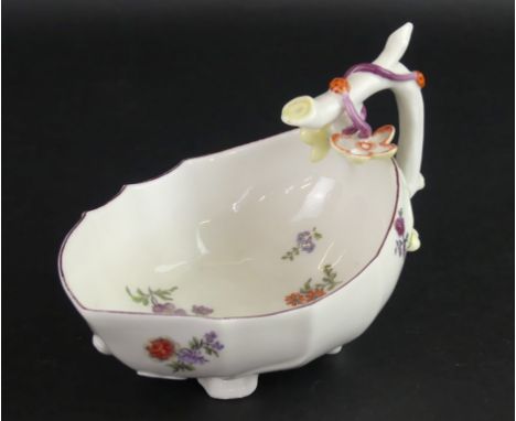 An 18th Century Chelsea soft paste porcelain sauce boatWith strawberry moulding and hand-painted floral decoration, red ancho