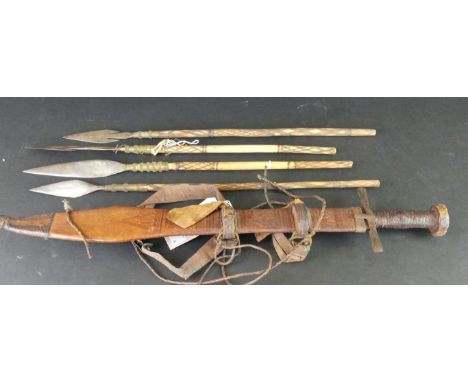 A Sudanese Kaskara sword early 20th CenturyThe 48cm straight double edged blade with twin fullered marks, steel cross guard, 