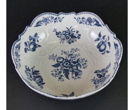 An 18th Century Worcester blue and white bowlOf circular form, decorated in the 'Pine Cone' pattern with three moulded relief