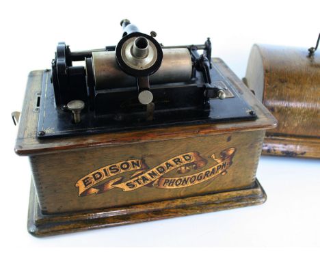 An oak cased Edison Standard phonographComplete with nine rolls    CONDITION REPORT:  Depth 14cm, small piece of inlay missin