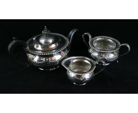 An Edwardian silver three piece Bachelor's tea serviceOf circular form, with an applied gadroon border, embossed ribbon and s