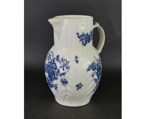 An 18th Century Worcester blue and white mask head jugDecorated in the 'Cabbage leaf' pattern, height 24cm 