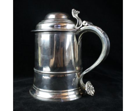 A George II English provincial silver lidded tankardOf conventional cylindrical form with mid-rib, with scroll thumb-piece, t