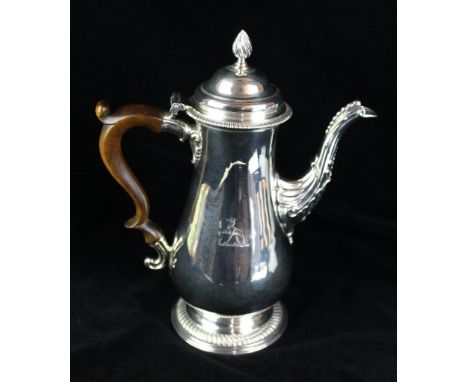 A George III silver coffee potOf plain baluster form, with applied fluted gadroon rim, the domed lid with a twist finial, to 