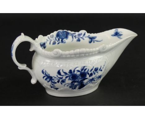 An 18th Century Worcester blue and white sauce boatWith relief moulding, decorated in the 'Two Porter Landscape' pattern, cre