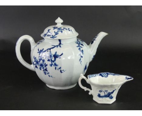 An 18th Century Worcester blue and white teapotOf bulbous form decorated in the 'Prunus Root' pattern, height 16cm, together 