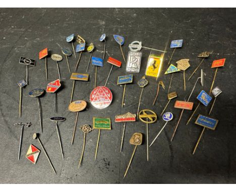 A collection of approximately 42 pins brooches badges all motoring themed including Ferrari, Bosch, Renault, Vauxhall, Chevro