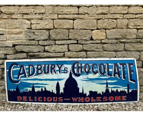 A very rare Cadbury's Chocolate pictorial enamel sign depicting a city skyline at night, by Falkirk Iron, heavily restored, 7